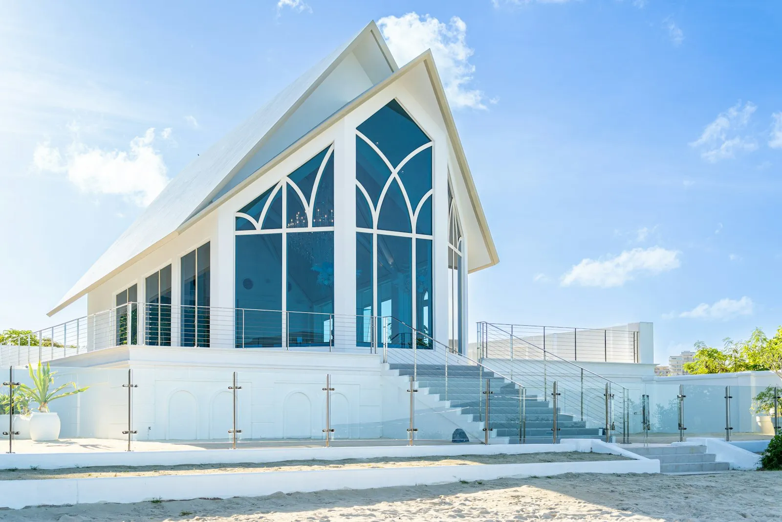 A large white building with a large glass window