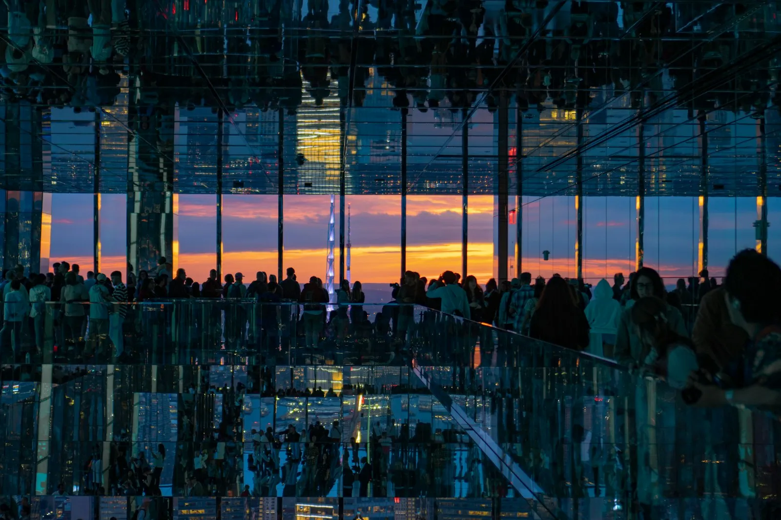A group of people standing in front of a window