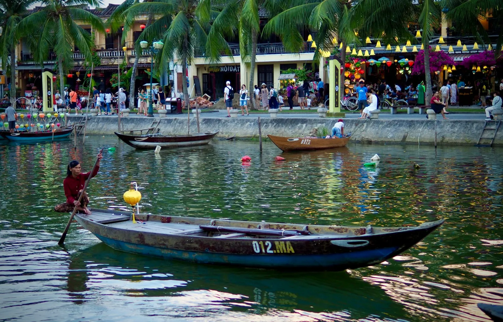 people riding on boat on river during daytime