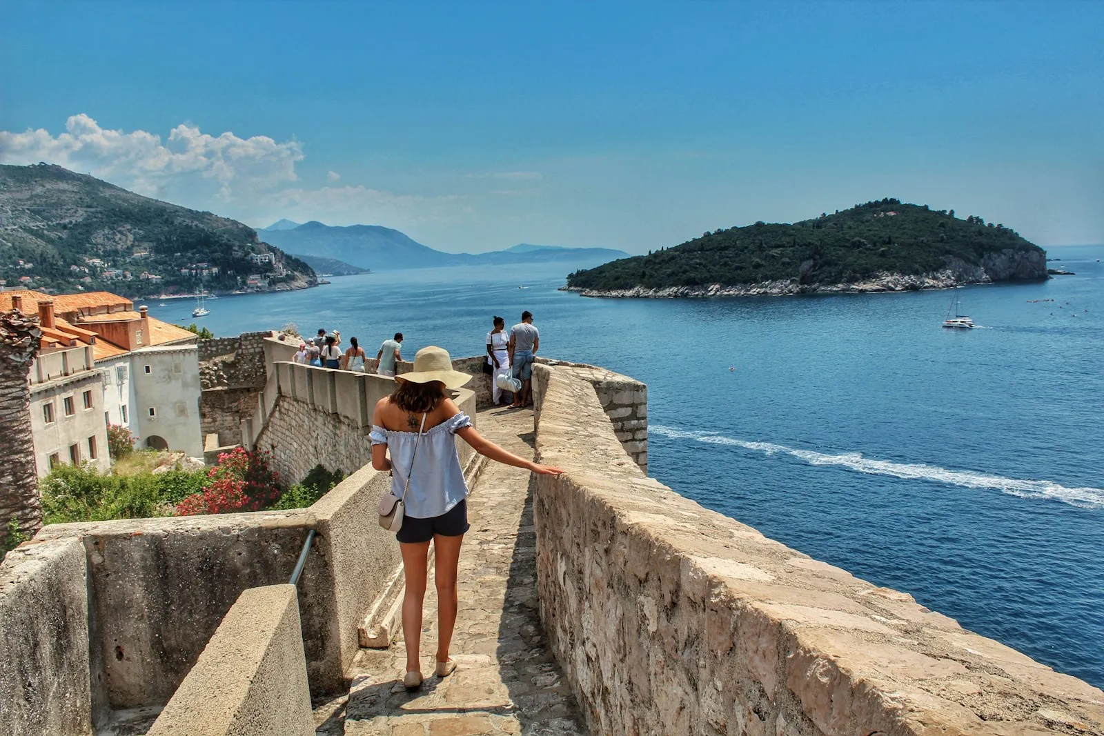 People walking on a concrete pathway
